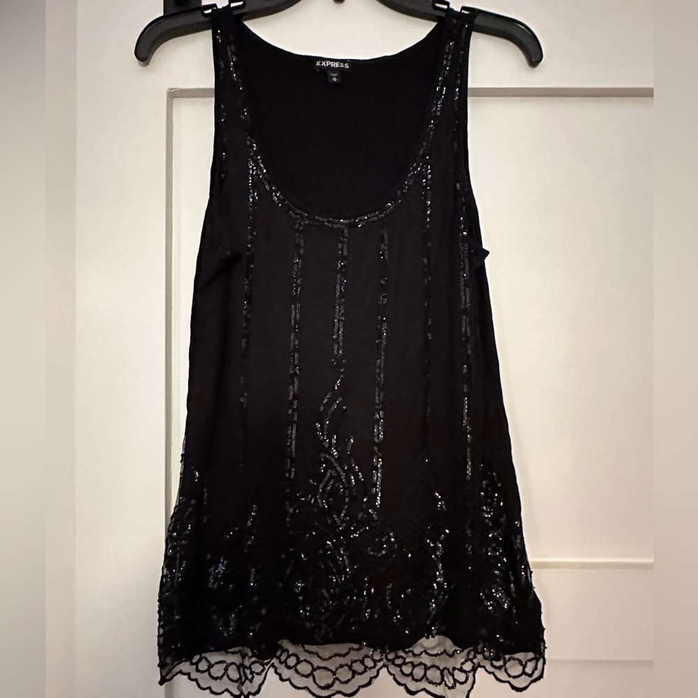 Woman’s black sequined tank top